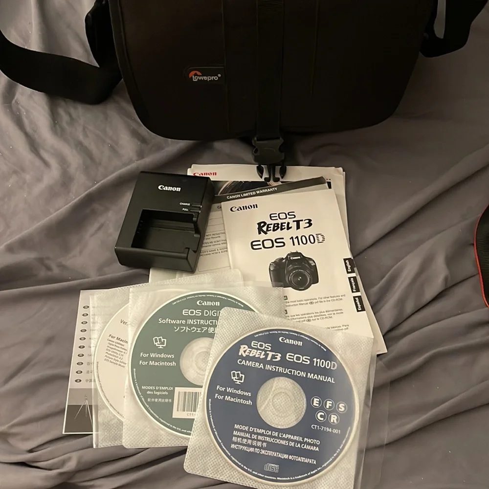 TOTAL CAMERA PACKAGE INCLUDES CANON T3 REBEL CAMERA, TELEPHOTO LENSE AND BAG